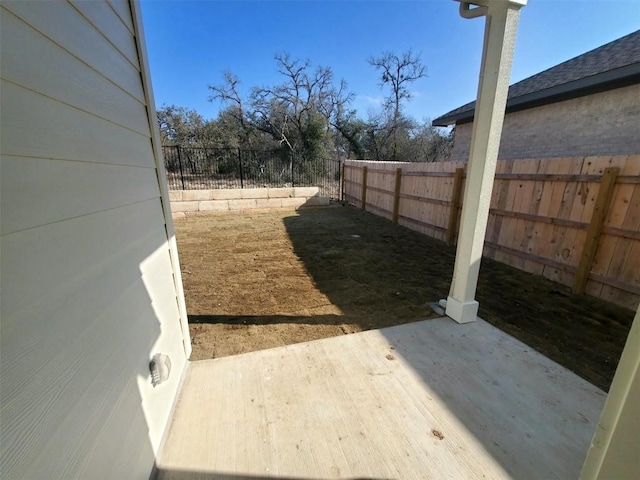 view of yard with a patio area and a fenced backyard