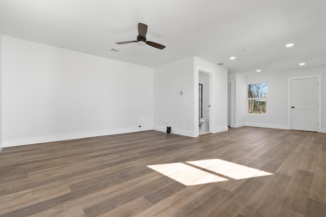 interior space with ceiling fan and hardwood / wood-style floors