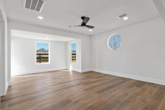 empty room with hardwood / wood-style flooring and ceiling fan