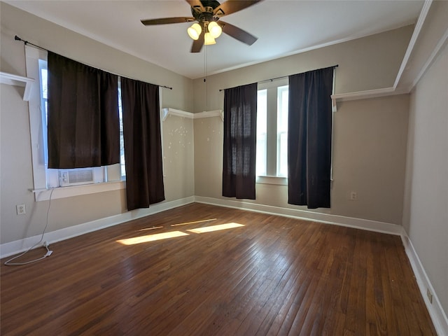 spare room with dark hardwood / wood-style flooring, cooling unit, and ceiling fan