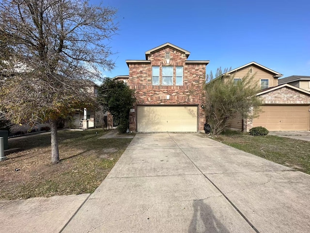 view of front property with a garage and a front lawn