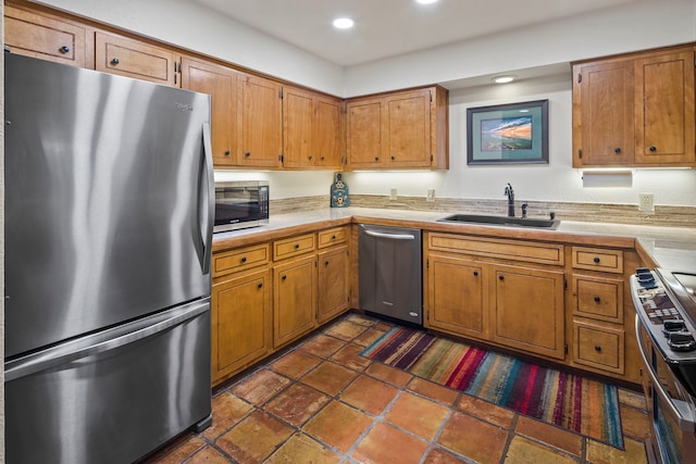 kitchen with sink and appliances with stainless steel finishes