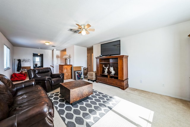 living room with light colored carpet and ceiling fan