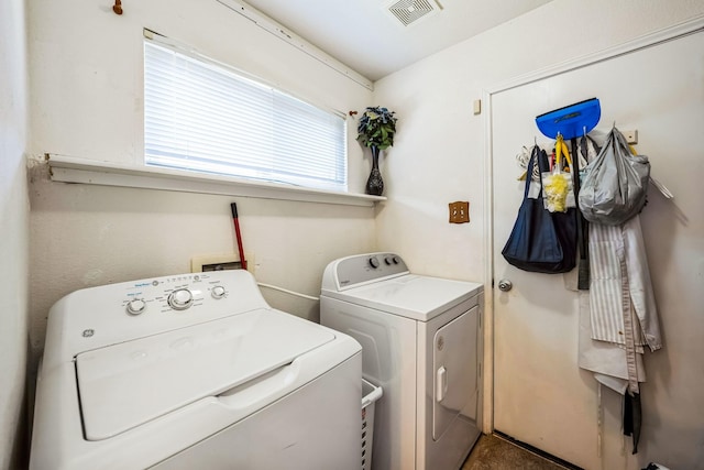 laundry room featuring washing machine and clothes dryer