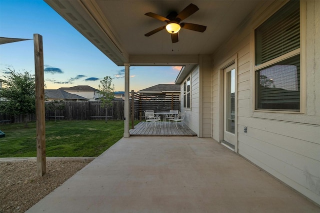 19004 Quebrada Dr, Pflugerville, TX 78660 - fenced backyard with a ceiling fan, a patio area, outdoor dining space, and a deck