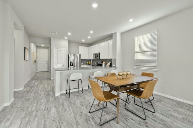 19004 Quebrada Dr, Pflugerville, TX 78660 - dining space with light wood-type flooring and recessed lighting