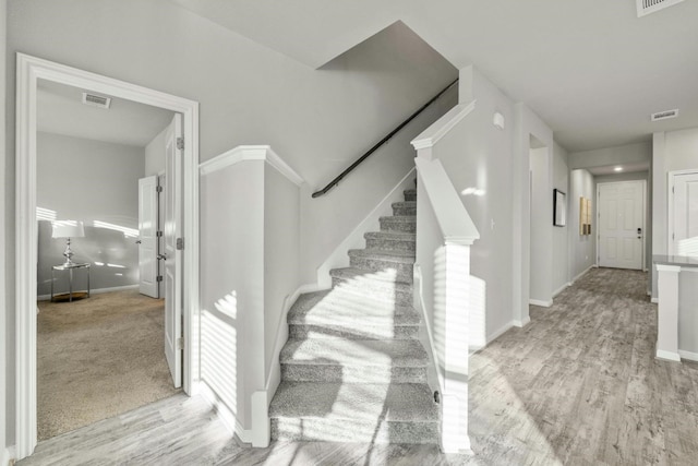 19004 Quebrada Dr, Pflugerville, TX 78660 - stairs featuring wood finished floors