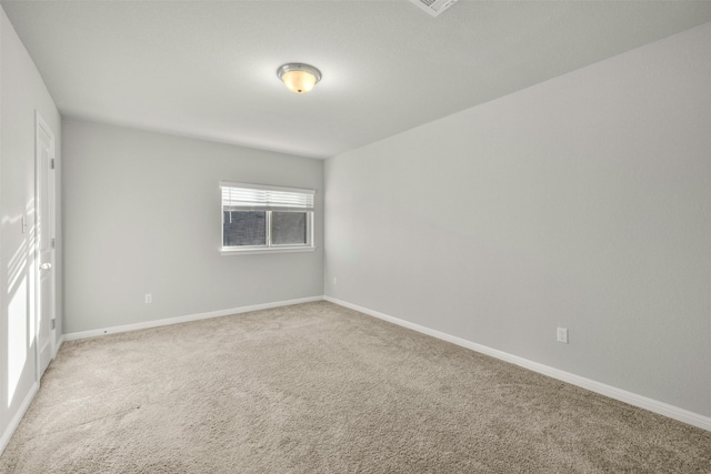 empty room with light colored carpet