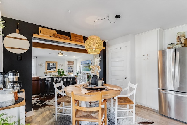 dining area featuring ceiling fan and light hardwood / wood-style floors