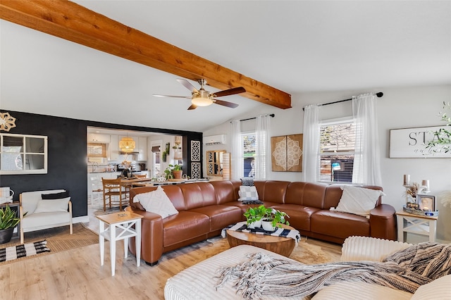 living room with ceiling fan, lofted ceiling with beams, and light hardwood / wood-style flooring