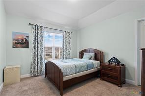 bedroom featuring light carpet