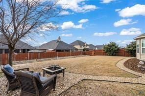 view of yard with an outdoor fire pit