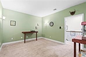 miscellaneous room with light colored carpet