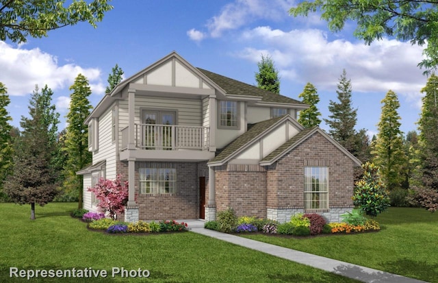 view of front of house with a balcony and a front yard