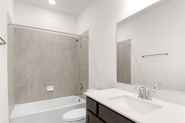 bathroom featuring toilet, shower / bath combination, and vanity