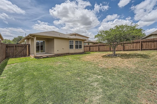rear view of property featuring a patio