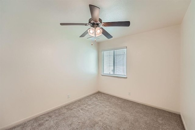 unfurnished room with light carpet, baseboards, and ceiling fan