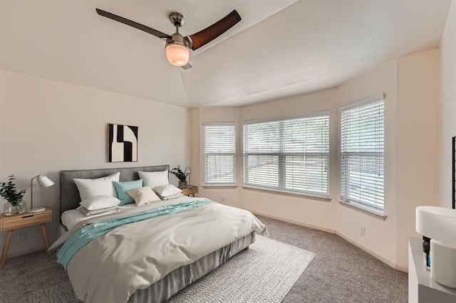 carpeted bedroom featuring baseboards and ceiling fan