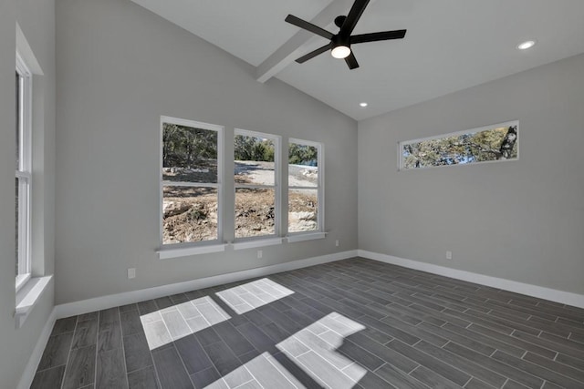 empty room featuring lofted ceiling with beams and ceiling fan