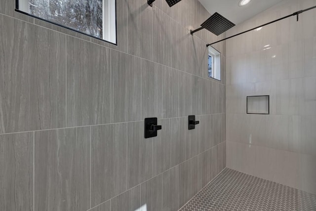 bathroom with a tile shower