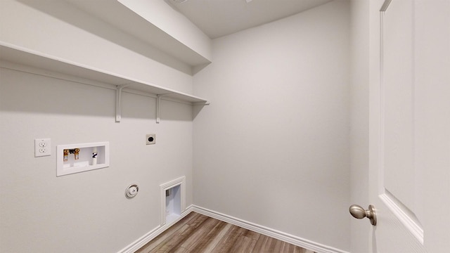 clothes washing area with dark wood-type flooring, washer hookup, hookup for an electric dryer, and hookup for a gas dryer