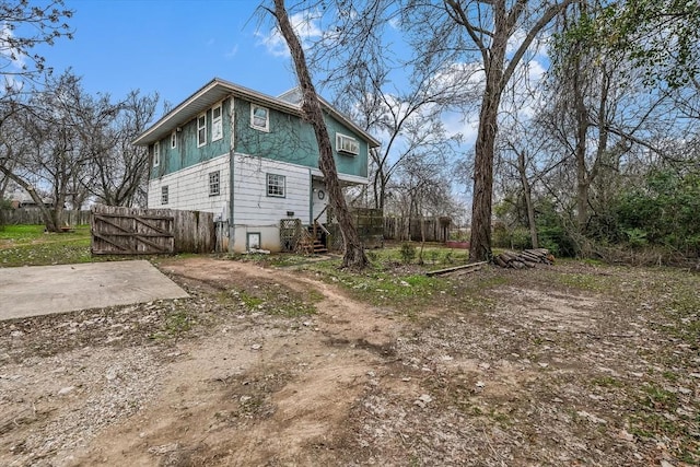 206 M L K Dr Unit B, Elgin, TX 78621 - view of home's exterior featuring a gate