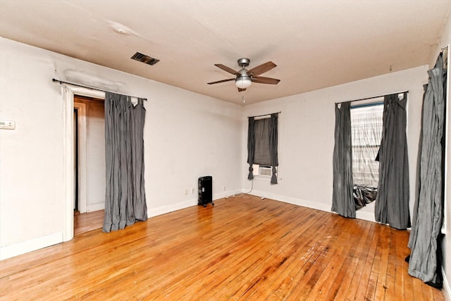 unfurnished room featuring ceiling fan and light hardwood / wood-style flooring