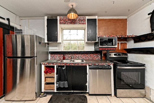 206 M L K Dr Unit B, Elgin, TX 78621 - kitchen with stainless steel appliances, light tile patterned floors, a sink, decorative backsplash, and ornamental molding