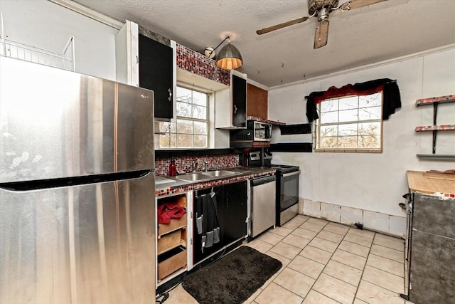 206 M L K Dr Unit B, Elgin, TX 78621 - kitchen with stainless steel appliances, a sink, light tile patterned flooring, a ceiling fan, and open shelves