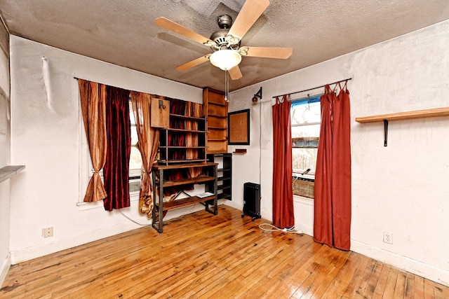 interior space featuring ceiling fan and light hardwood / wood-style flooring