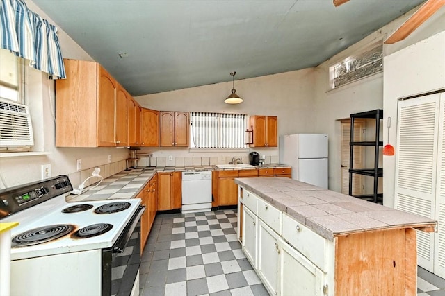 206 M L K Dr Unit B, Elgin, TX 78621 - kitchen featuring white appliances, light floors, vaulted ceiling, tile countertops, and decorative light fixtures