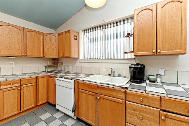206 M L K Dr Unit B, Elgin, TX 78621 - kitchen featuring white dishwasher, a sink, tile counters, light floors, and lofted ceiling