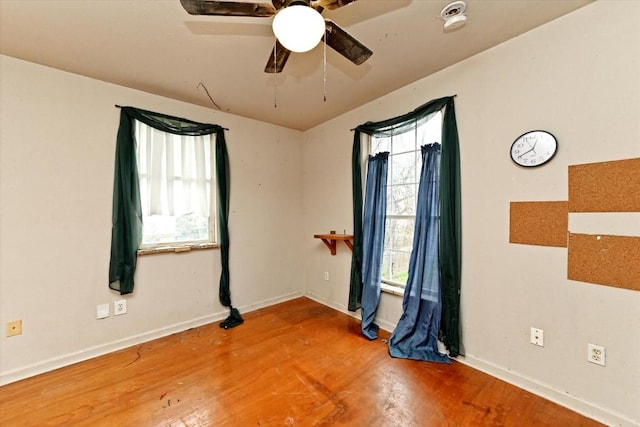 206 M L K Dr Unit B, Elgin, TX 78621 - spare room featuring healthy amount of natural light, wood finished floors, and a ceiling fan