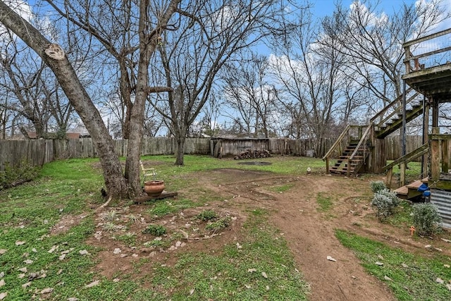 206 M L K Dr Unit B, Elgin, TX 78621 - fenced backyard featuring stairs and a deck