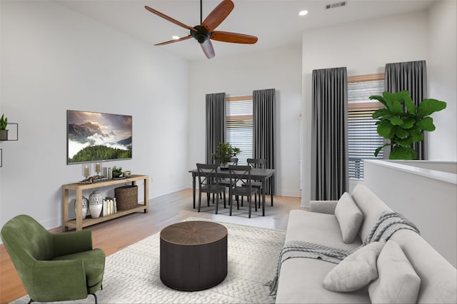 1702 S Lamar Blvd Unit 22, Austin, TX 78704 - living room with wood finished floors, ceiling fan, and recessed lighting