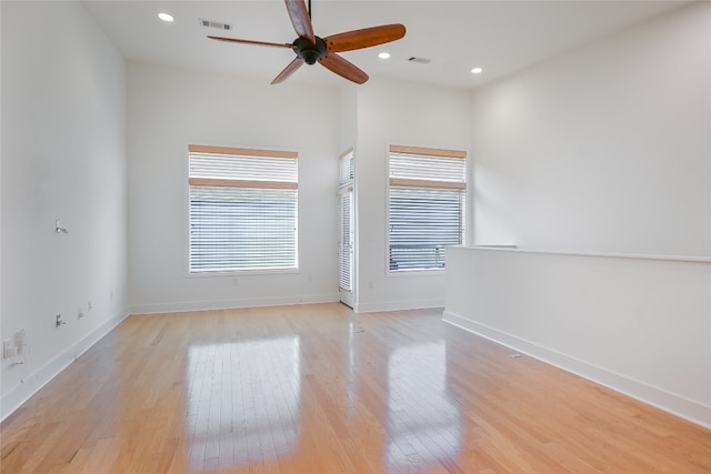 1702 S Lamar Blvd Unit 22, Austin, TX 78704 - unfurnished room with a ceiling fan, light wood-style flooring, and recessed lighting