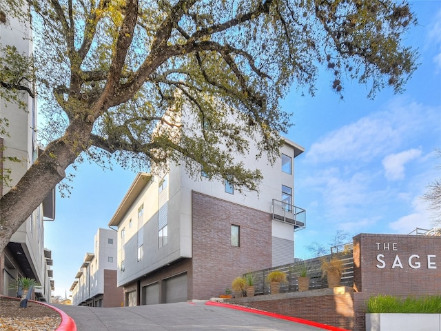 1702 S Lamar Blvd Unit 22, Austin, TX 78704 - view of building exterior featuring a garage