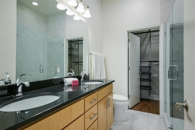 1702 S Lamar Blvd Unit 22, Austin, TX 78704 - full bath featuring marble finish flooring, double vanity, a marble finish shower, and a spacious closet