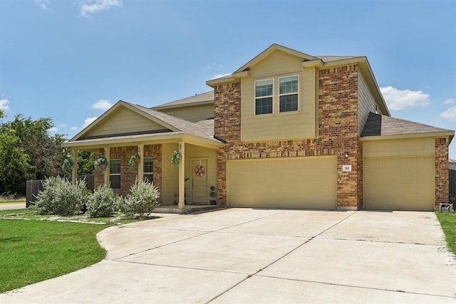 view of front facade featuring a garage and a front yard