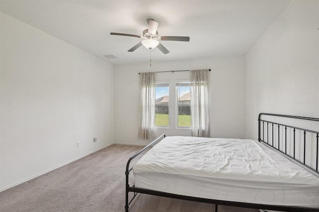 bedroom featuring ceiling fan and carpet flooring