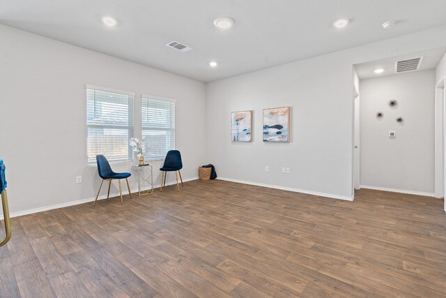 unfurnished room featuring dark hardwood / wood-style flooring