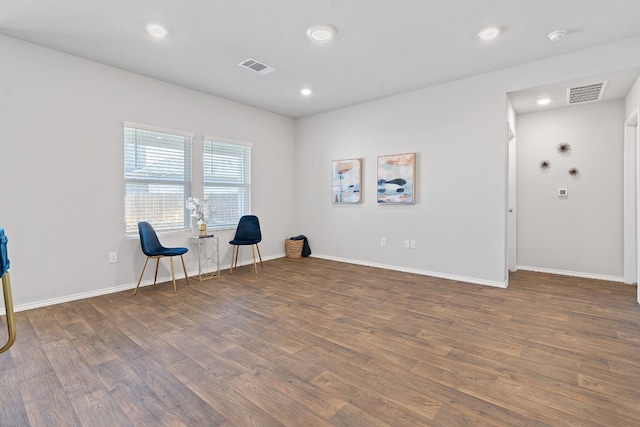 unfurnished room featuring recessed lighting, visible vents, baseboards, and wood finished floors