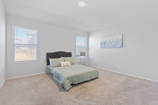 bedroom with carpet and baseboards