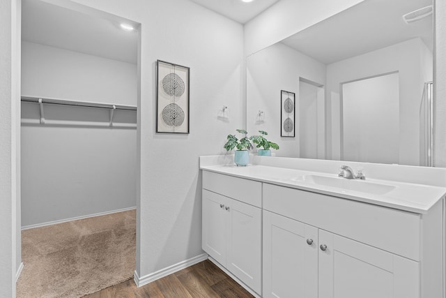 bathroom featuring hardwood / wood-style flooring and vanity