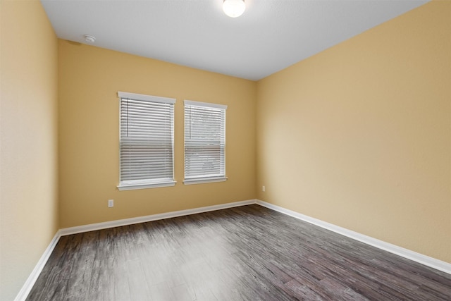 spare room with hardwood / wood-style floors