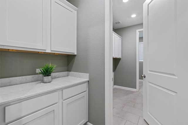 washroom featuring light tile patterned flooring