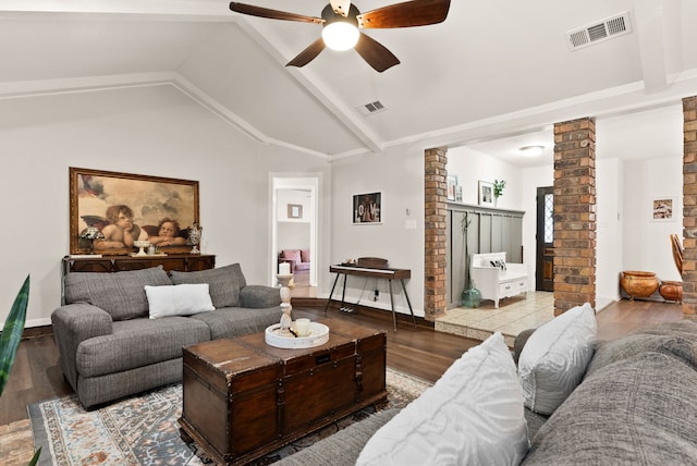 living room with decorative columns, vaulted ceiling, hardwood / wood-style flooring, and ceiling fan