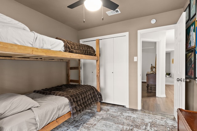 bedroom with ceiling fan and light hardwood / wood-style flooring