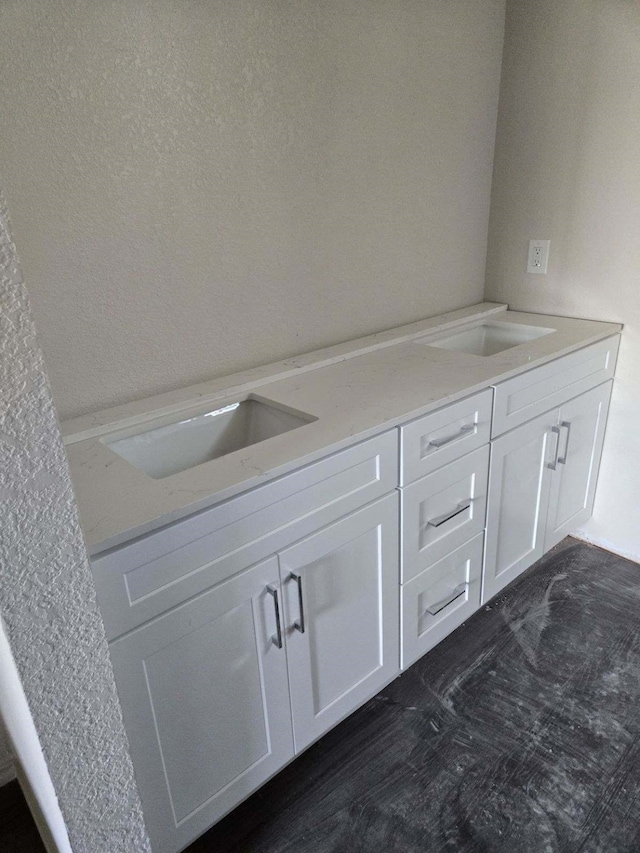 bathroom with vanity and wood-type flooring