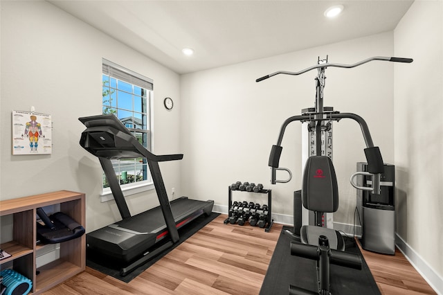 exercise area featuring hardwood / wood-style floors